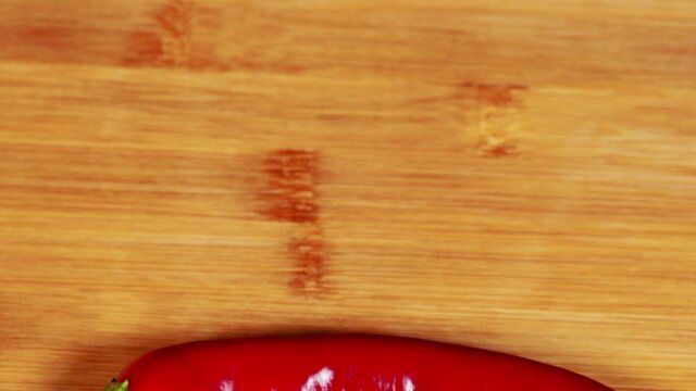 Fresh chili pepper on wood background. Hot, spicy, freshness concept.