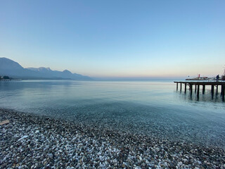 
evening transparent sea turkish pebble beach in turkey