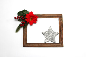 Sparkling stars as decorated frame for Christmas messages with poinsettia flowers and pinwheels
