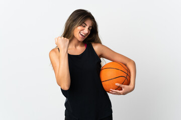 Young caucasian woman isolated on white background playing basketball