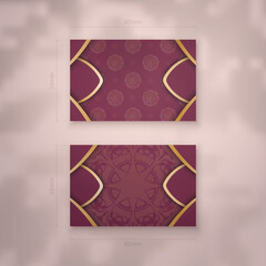 Presentable business card in burgundy color with gold mandala ornament for your personality.