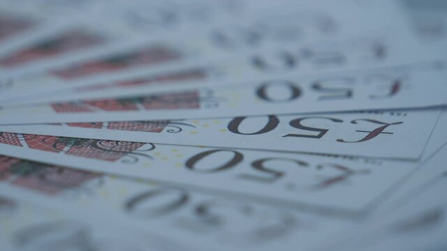 A close up view of 50 pound notes.