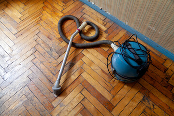 vacuum cleaner on parquet floor. View from above..
