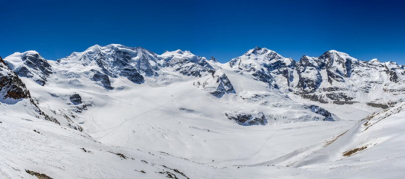 Panorama of Swiss Alp mountains ridge of Diavolezza with sumit group: d&rsquo;Arlas, Cambrena, Palue, Bellavista, Bernian, Rosseg, Provat, Morteratsch in Canton Grisons, Switzerland