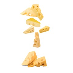 Falling fresh tasty yellow cheese on a background