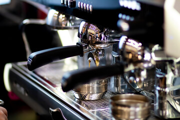 Close up pic of a proffesionnal coffee machine in a coffee shop preparing hot coffee