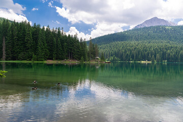 Fototapeta na wymiar Glacial Black Lake with Meded Peak. Premium tourist attraction of Durmitor National Park. Montenegro.