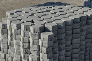 Obraz premium Gray pavement bricks for pavement road. Stack paving stones stacked in stacks. 