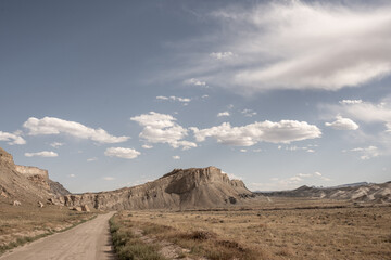 Dirt Road Heads Toward Ridge Rising From Desert Floor