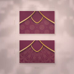 Visiting business card in burgundy color with greek gold pattern for your business.