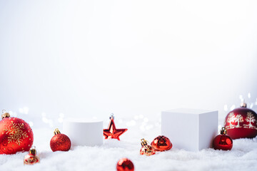 Winter Christmas composition with geometric shapes podiums and red christmas decorations on white...