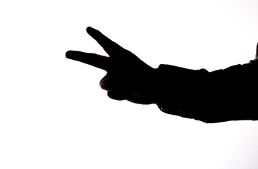 High contrast photography, against the light, hands making movements, actions, holding cell phone, pointing, hands of a young man.