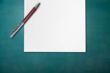 Covid-19 booster shots vaccine symbol. White note with metallic pen.