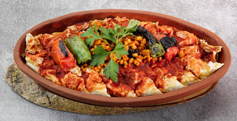 top view of Turkish Beyti Kebap garnished with vegetables on a wooden tray - Turkish, Arabian Food Kebab