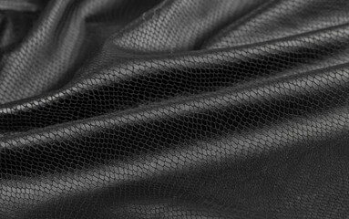 black background from eco-leather. black artificial leather texture