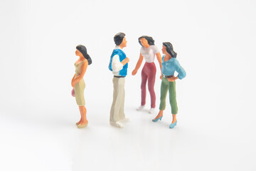 miniature people. concept of family people in relationships on a white background. the problem of fidelity in marriage.