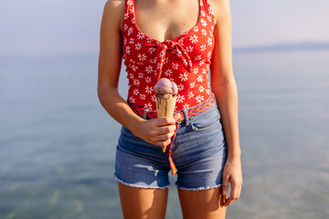 Close-up of woman holding ice cream cone