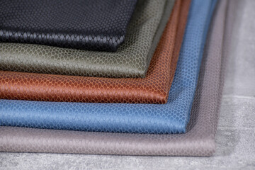 textured fabric made of eco leather in different colors, stacked