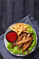 crispy fried capelin with lettuce, french fries