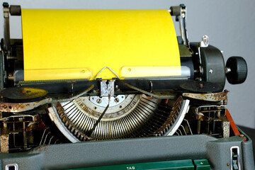 typewriter on table, words fake news are printed on paper in large size, vintage lantern shines,...