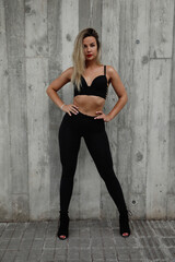 Young and beautiful woman dancer posing outdoor. Flexible sexy woman. Vertical.