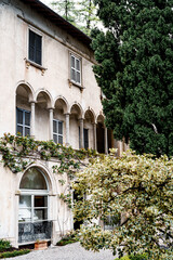 Fototapeta na wymiar Wall with a long arched terrace in Villa Monastero. Lake Como, Italy