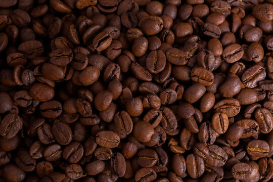 Brown roasted coffee beans. close-up. background. copy space. Free space for text, flat lay