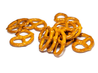 Pretzels with salt on a white background. Flour products. Baking for tea.