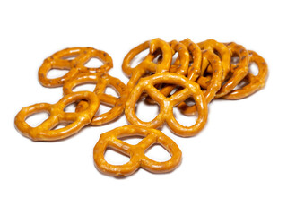 Small pretzels on a white background.   Baking for tea. Crispy biscuits.
