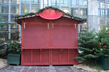 The Christmas market is set up, but the wooden stall is still closed, hoping that the event is not...