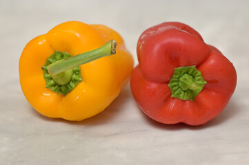 Still life with fresh ripe vegetables: red and yellow paprika