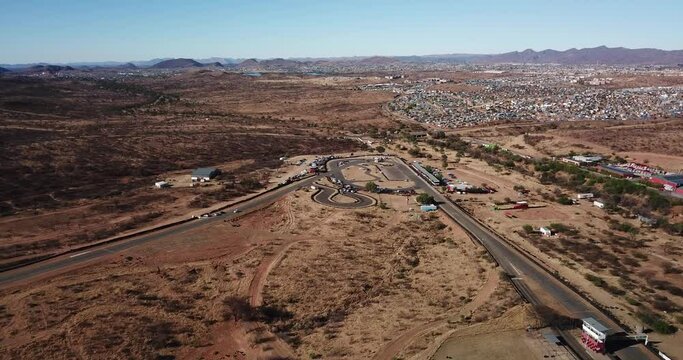 4K aerial drone video of Tony Rust racing track near Otjomuise township in Windhoek on hot sunny day, central Namibia, southern Africa