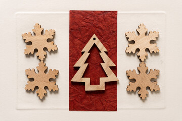 christmas tree and snowflake decorations on paper