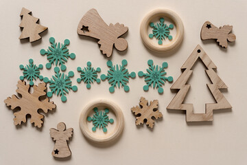 wooden christmas ornaments or embellishments (some painted) on paper
