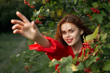Naklejka premium pretty woman in red shirt bush nature freedom