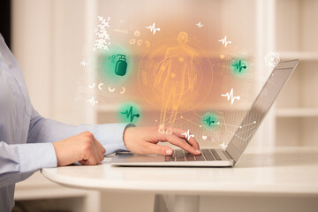 Doctor working on laptop with healthcare concept