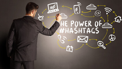 businessman drawing social media icons concept