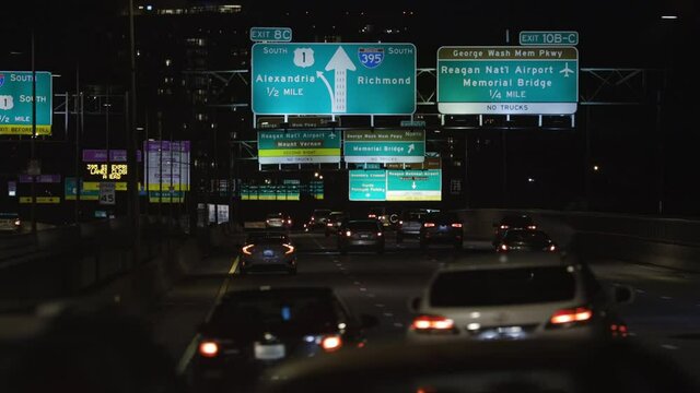 Cars Drive On 14th Street Bridge On Interstate 395 In Washington DC At Night