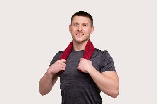 Man smilling with Towel on Neck Isolated. Sportsman Portrait with Towel in Hands