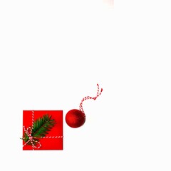 Christmas template for invitation letter with red square envelope decorated with a christmas tree branch and ball-shaped red christmas tree toy