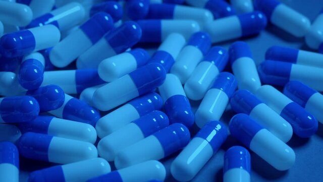 Pharma Capsules Pour Out Closeup