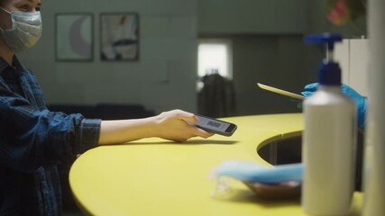 Vaccination passport qr code control, woman checking on phone European coronavirus covid 19 vaccine passport to enter cafe, restaurant. Tourist show international certificate in airport terminal.