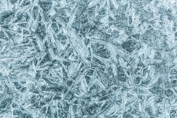 closeup of cracked ice surface. winter textured background.
