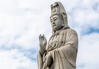 Fototapeta na wymiar Giant Buddha statue at temple in Kanchanaburi Thailand