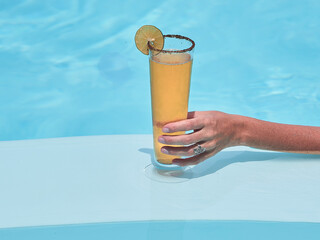 Cold Beer with Lemon in a long tail glass during summer