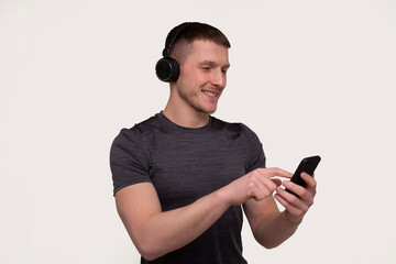 Sport Man Listening to Music from Phone and Enjoys. Trainer Listening Music. Good Music. man relaxing. Music for Sport