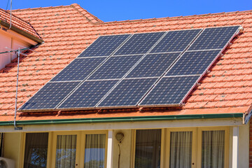 Solar panels on a suburban house roof in Melbourne, Australia
