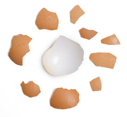 Top view group of broken eggshells stacked on white background.