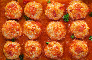 Chicken meatballs in paprika and tomato sauce. Turkey meatballs. Background, texture