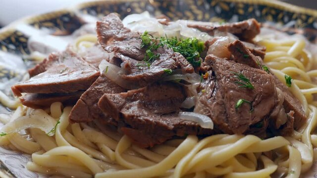 Etnic Kazakh food - beshbarmak, meat with noodles